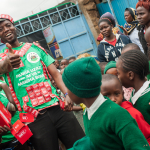 Volunteer distributes condoms during health fair