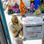 Workers unload boxes of oral polio vaccine