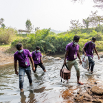 Deworm3 field workers travel on foot to collect soil and stool samples GA16978546