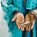 Sayana Press device held in hand